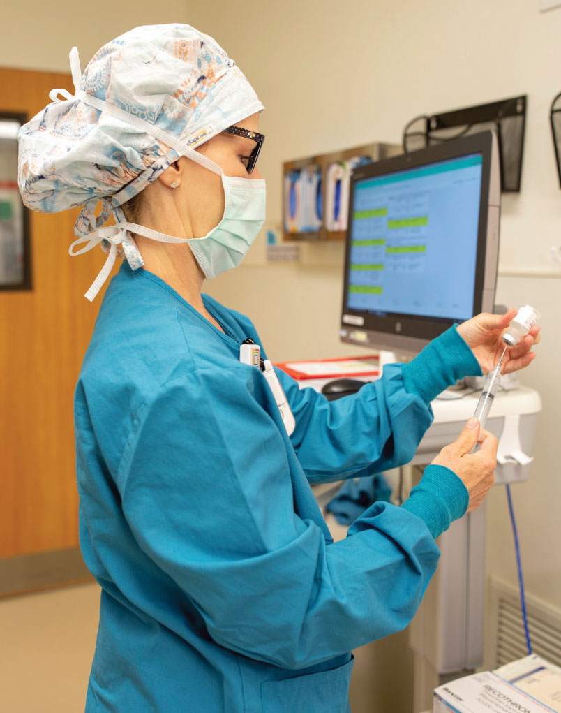 Main operating room —  nurse setting up for surgery 